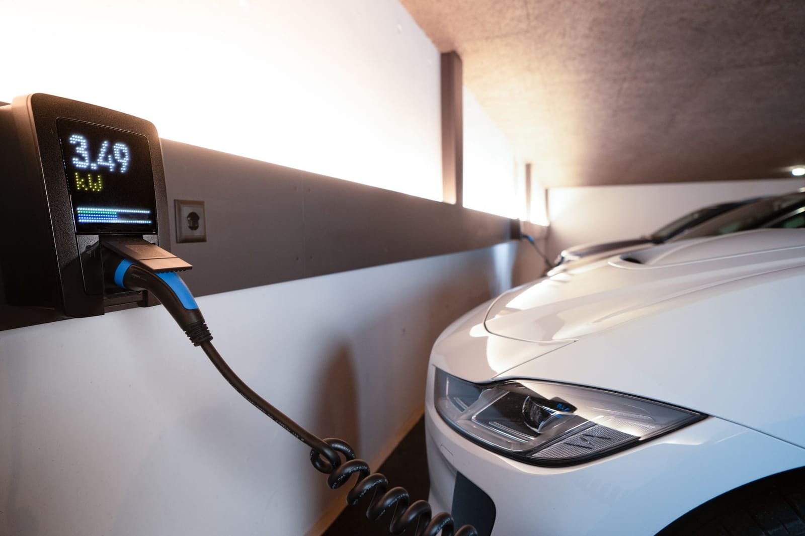 Commercial EV charger display showing a charging session in progress